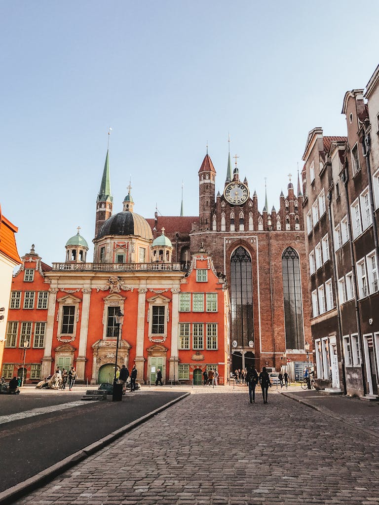 Beautiful street view of historic European buildings under a clear sky.